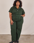 Morgan is 5'5" and wearing 2XL Short Sleeve Jumpsuit in Swamp Green