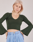 Madeline is 5'9" and wearing P Bell Sleeve Top in Swamp Green