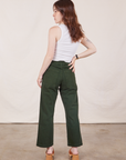 Back view of Petite Work Pants in Swamp Green and Cropped Tank Top in vintage tee off-white on Hana