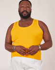 Elijah is 6’0 and wearing 3XL Tank Top in Sunshine Yellow
