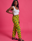 Side view of Checkerboard Work Pants in Green/Yellow and Cropped Tank in Vintage Tee White