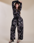 Sydney is wearing Magic Waters Drop Pocket Pants in Ink Blot and matching long sleeve baby tee