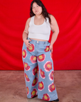 Ashley is 5'7" and wearing 1XL Wide Leg Denim Trousers in Painted Flowers paired with a Cropped Tank in Vintage Tee Off-White