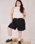 Ashley is 5’7” and wearing 1XL Trouser Shorts in Basic Black paired with a Sleeveless Turtleneck in Vintage Tee Off-White