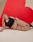 Work Pants in Hot Stuff Print and black Cropped Tank worn by Juliet
