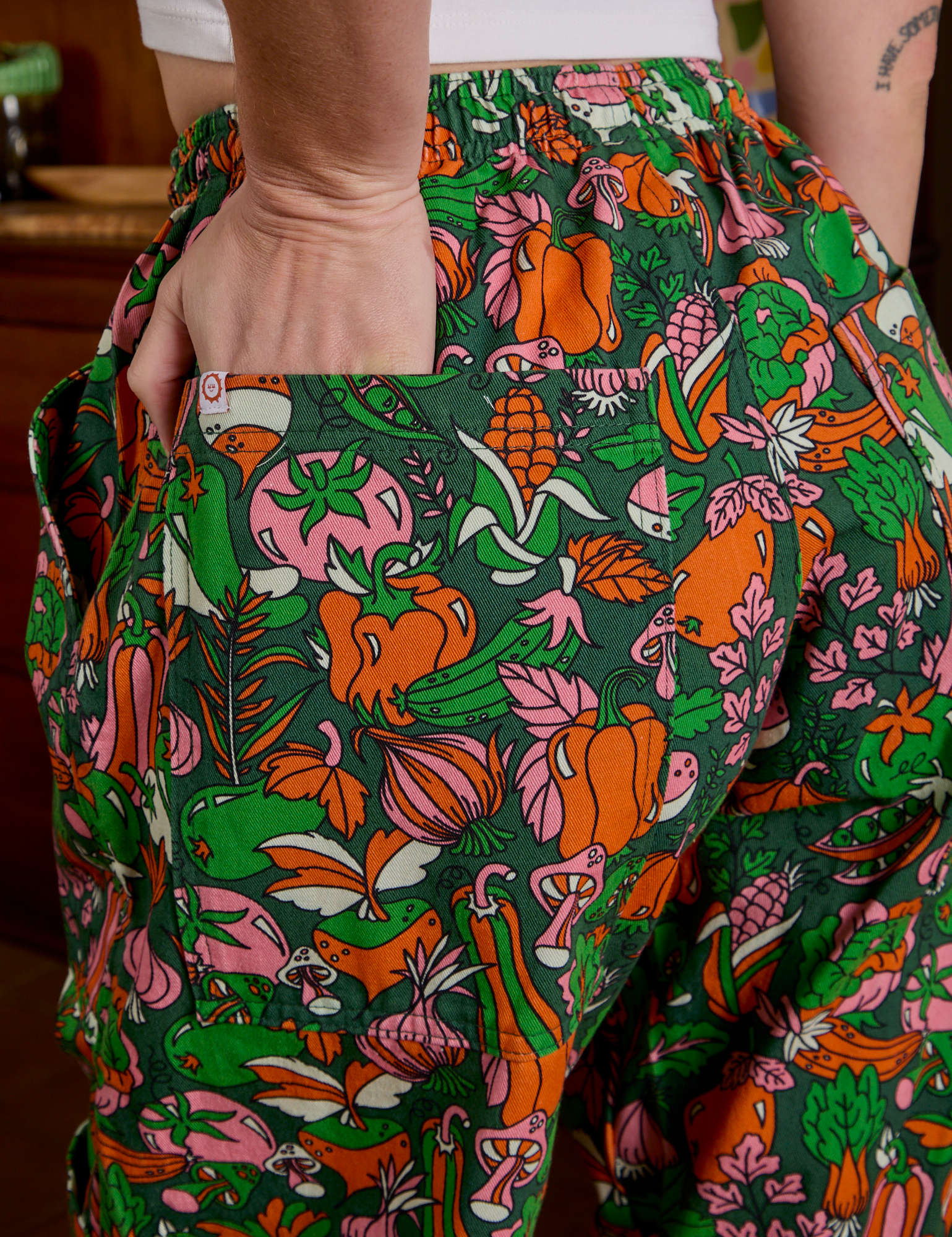 Close up of Alex's hand in the back pocket of Drop Pocket Cargo Pants in Kitchen Collection