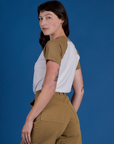 Angled back view of Produce Raglan Tee in Onion on Alex