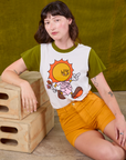 Anniversary Tee in Walkin' On Sun Baby and mustard yellow Work Shorts on Alex