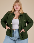 Juliet is 5'8" and wearing L Denim Work Jacket in Evergreen