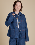 Hana is 5'3" and wearing P Indigo Denim Work Jacket in Dark Wash