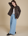 Hana is wearing Denim Work Jacket in Espresso Brown and light wash Indigo Wide Leg Trousers