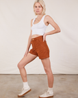 Side view of Classic Work Shorts in Burnt Terracotta and Cropped Tank Top in vintage tee off-white on Madeline