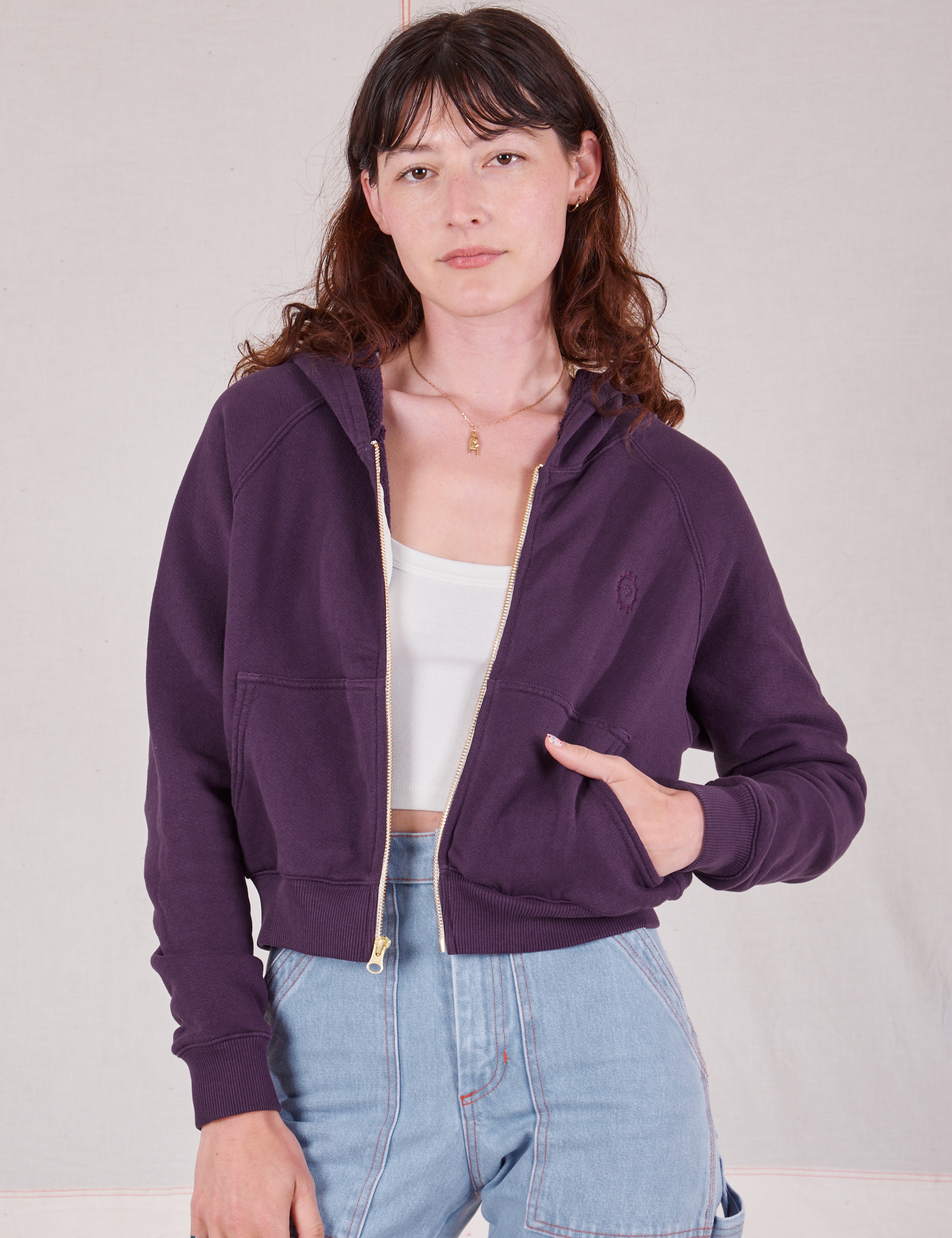 Alex is 5&#39;8&quot; and wearing P Cropped Zip Hoodie in Nebula Purple with a vintage off-white Cropped Tank underneath