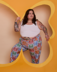 Sam is wearing Butterfly Kaleidoscope Work Pants and Cropped Tank in Vintage Tee White