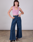 Alex is wearing Cropped Tank Top in Lilac paired with dark wash Indigo Wide Leg Trousers