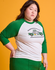 Taxi Raglan Tee in Chicago angled front view on Ashley