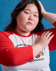 Taxi Raglan Tee in NYC with red sleeves on Ashley