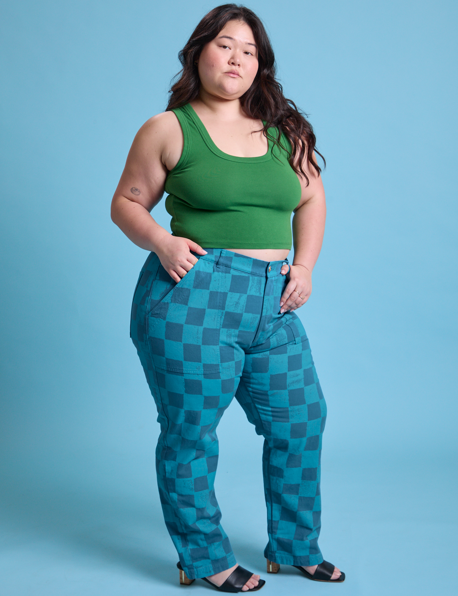 Angled front view of Checkerboard Work Pants in Blues and lawn green Cropped Tank on Ashley