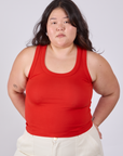 Ashley is 5'7" and wearing L Tank Top in Mustang Red
