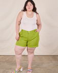 Ashley is wearing Classic Work Shorts in Gross Green and Tank Top in Vintage Tee Off-White