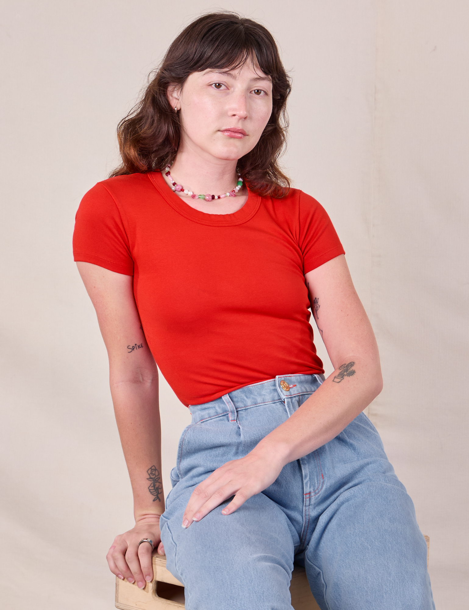 Baby Tee in Mustang Red worn by Alex