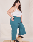 Side view of Petite Bell Bottoms in Marine Blue and Halter Top in vintage tee off-white on Ashley