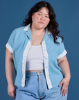 Ashley is 5’7” and wearing L Painted Pantry Button-Up in Baby Blue