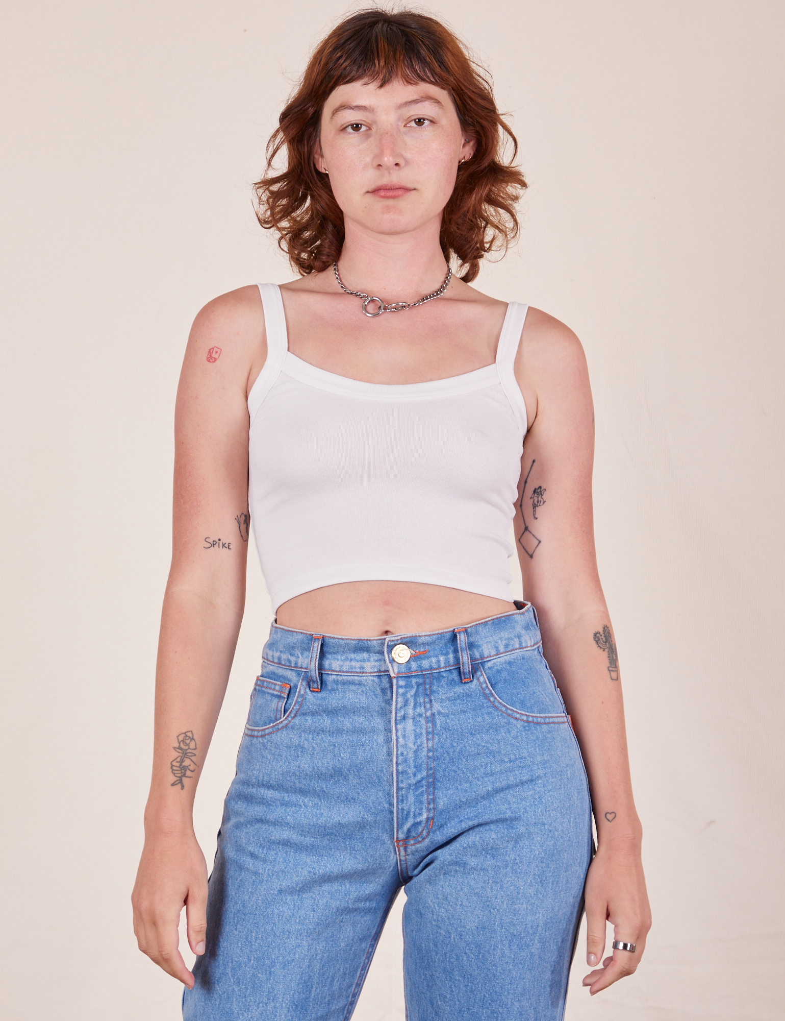 Alex is 5&#39;8&quot; and wearing P Cropped Cami in Vintage Off-White worn with light wash Frontier Jeans