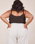 Back view of Cropped Cami in Espresso Brown and vintage tee off-white Western Pants worn by Alicia. She has both hands in the back pant pockets.