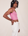 Side view of Cropped Cami in Bubblegum Pink and vintage off-white Western Pants worn by Jerrod