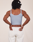 Back view of Cropped Cami in Periwinkle and vintage tee off-white Western Pants worn by Jerrod