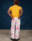 Back view of Paintstamped Work Pants in Bubblegum and sunshine yellow Organic Vintage Tee