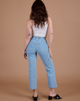 Carpenter Jeans in Light Wash back view on Alex