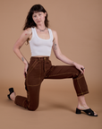 Carpenter Jeans in Fudgesicle Brown and Cropped Tank in Vintage Tee White on Alex