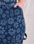 Close up of Ashley's hand in the front pocket of Carpenter Overalls in Lazy Daisy