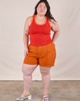 Ashley is wearing Colorblock Cropped Tank in Mustang Red and burnt orange Work Shorts