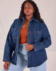 Meghna is 5'7" and wearing XS Denim Overshirt in Dark Wash with a burnt terracotta Cropped Tank underneath