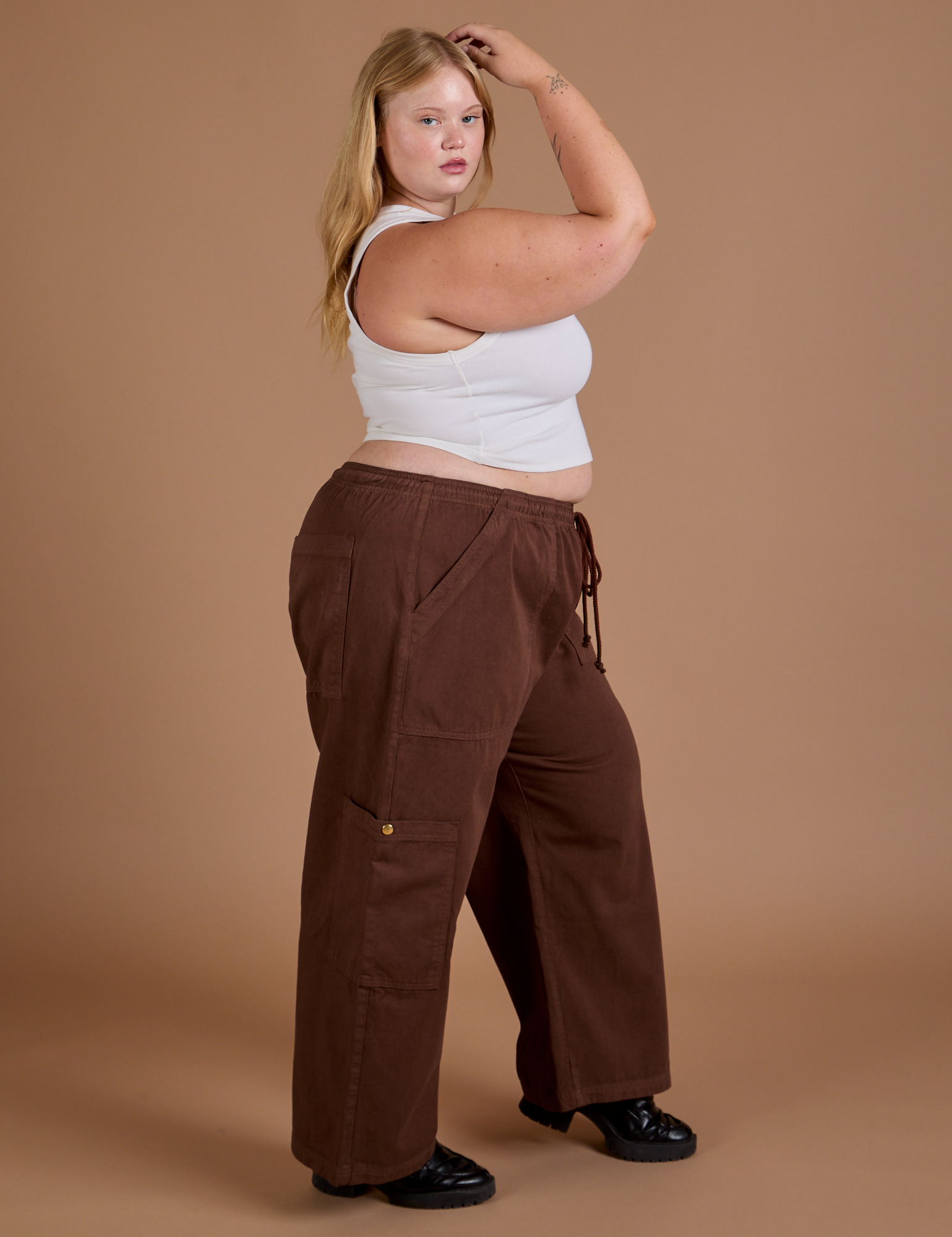 Side view of Drop Pocket Cargo Pants in Fudgesicle Brown and Cropped Tank in vintage tee white
