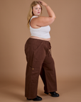Side view of Drop Pocket Cargo Pants in Fudgesicle Brown and Cropped Tank in vintage tee white