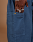 Close up of Jerrod's hand tucked into the side pant leg pocket