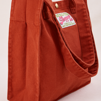 Angled view of Shopper Tote Bag in Paprika