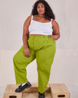 Morgan is wearing Heavyweight Trousers in Gross Green and Cami in vintage tee off-white