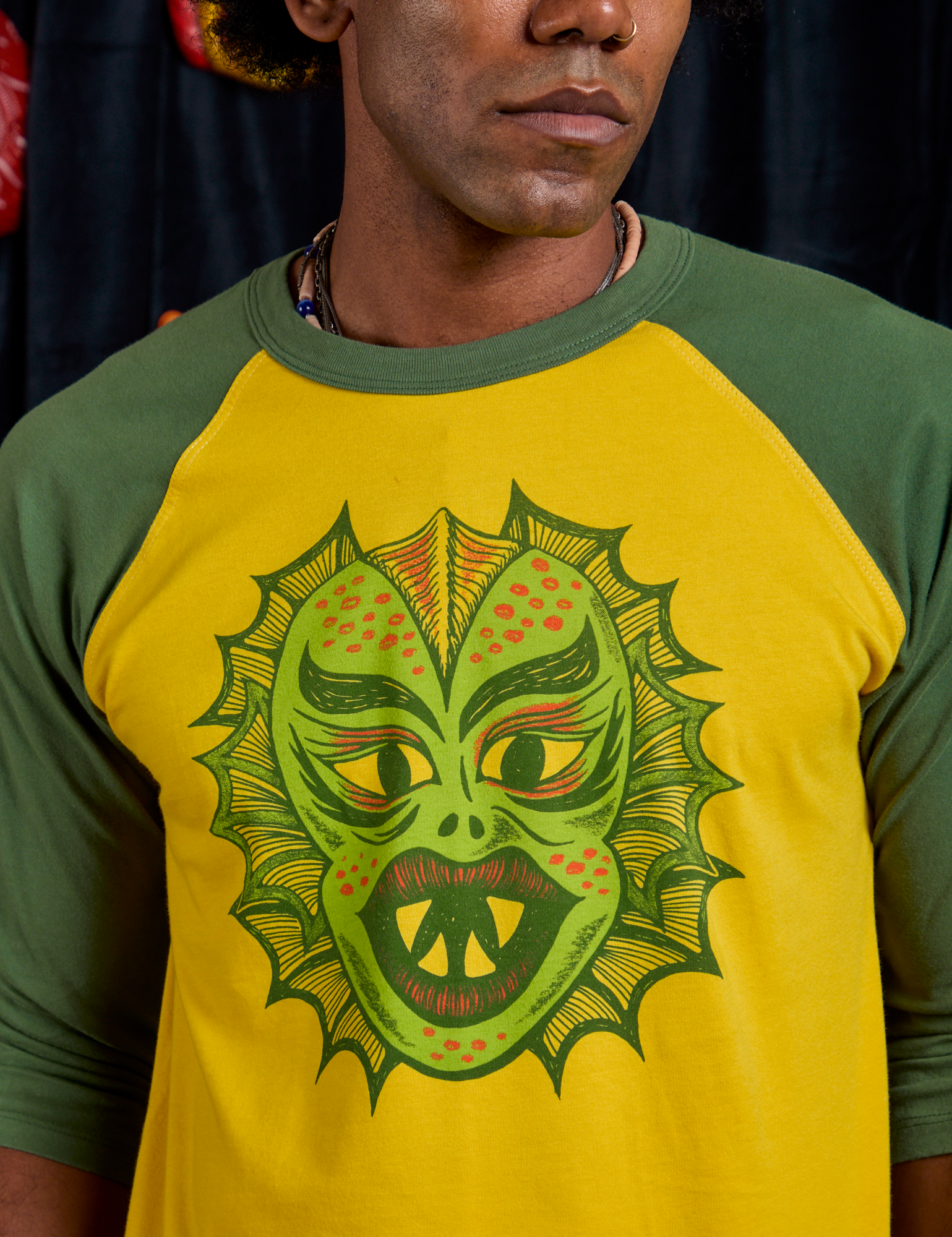 Raglan Tee in Creature front close up on Jerrod