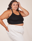 Angled view of Halter Top in Basic Black and vintage off-white Western Pants worn by Alicia