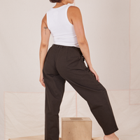 Angled back view of Heavyweight Trousers in Espresso Brown and vintage off-white Cropped Tank Top worn by Tiara.