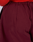 Pleated Trouser Shorts in Red Wine back view close up on Juliet