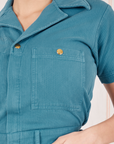 Front pocket close up of Heritage Short Sleeve Jumpsuit in Marine Blue worn by Tiara