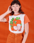 Alex is wearing Anniversary Tee in Orange Blossom tucked into Work Shorts