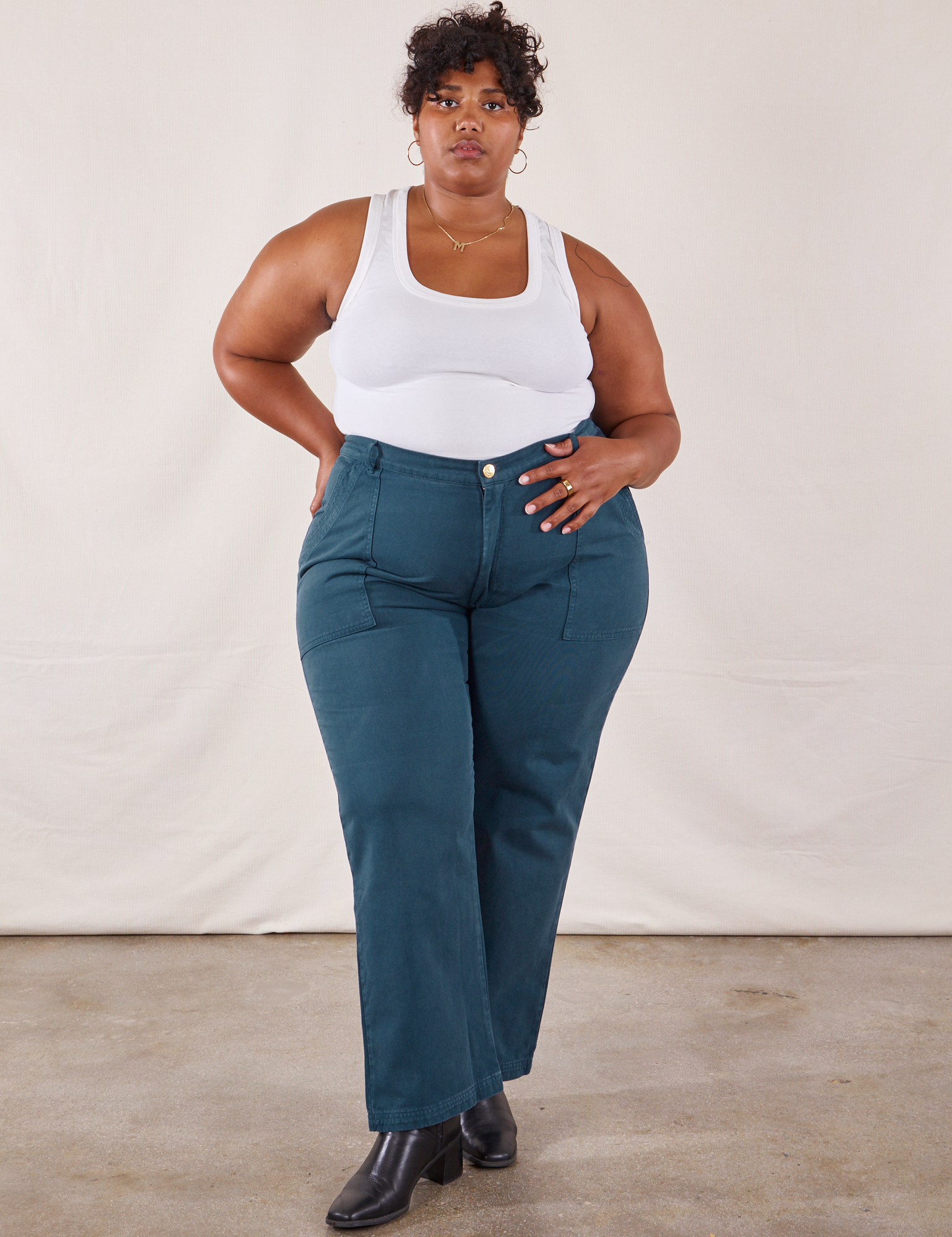 Morgan is wearing Work Pants in Lagoon and vintage tee off-white Tank Top