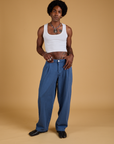 Jerrod is 6'3" and wearing M Baggy Mid-Rise Trousers in French Blue paired with a vintage tee white Cropped Tank